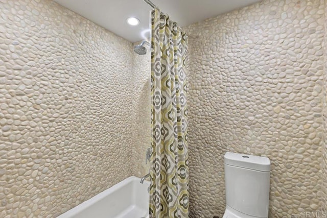 bathroom with shower / bath combo with shower curtain