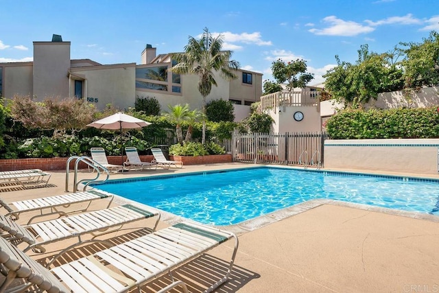 view of swimming pool featuring a patio area