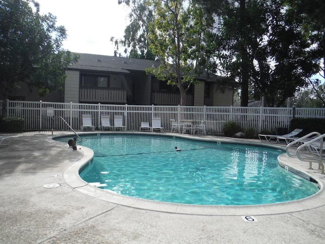 view of swimming pool with a patio