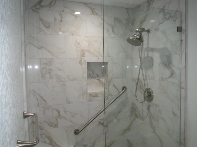 bathroom with tiled shower