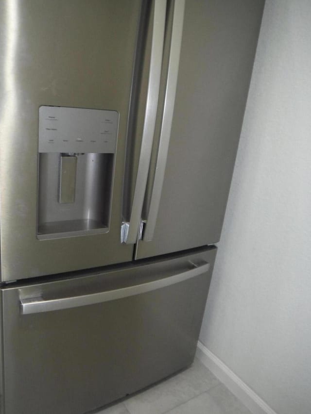 room details featuring stainless steel fridge