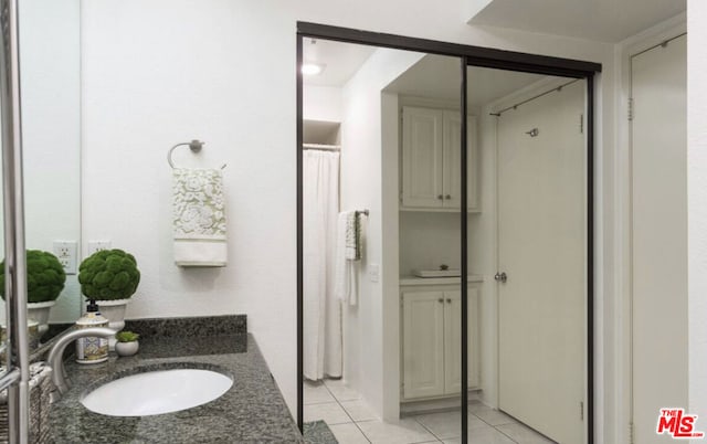 bathroom featuring vanity and tile patterned flooring