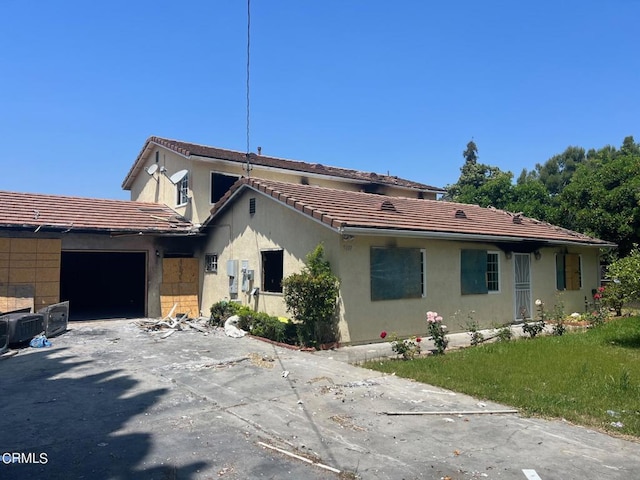 view of side of property featuring a garage