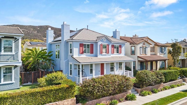 view of front of property with a mountain view