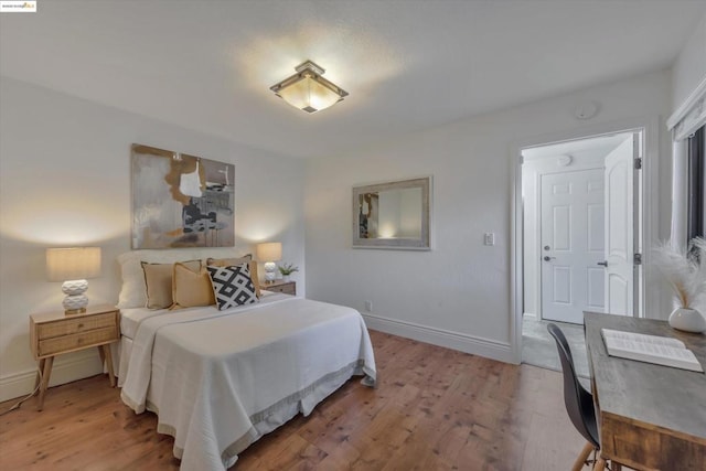 bedroom with wood-type flooring