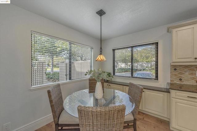 dining space with a wealth of natural light and light hardwood / wood-style floors