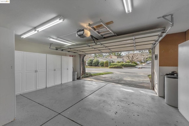 garage with a carport and a garage door opener