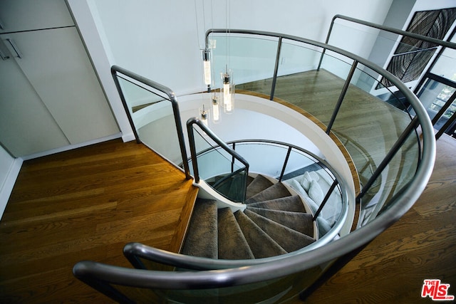 stairway featuring hardwood / wood-style floors