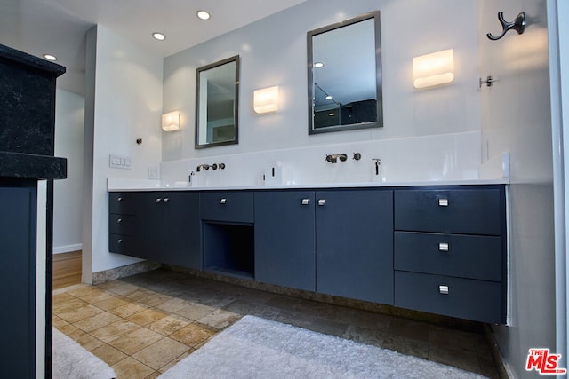 bathroom featuring vanity and tile patterned flooring