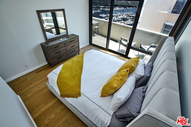 bedroom with hardwood / wood-style floors