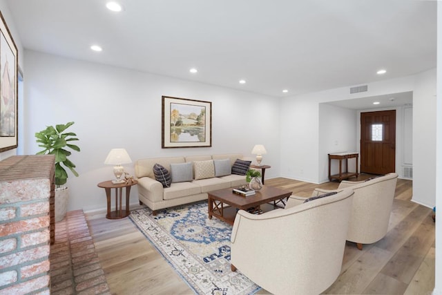 living room with light hardwood / wood-style floors