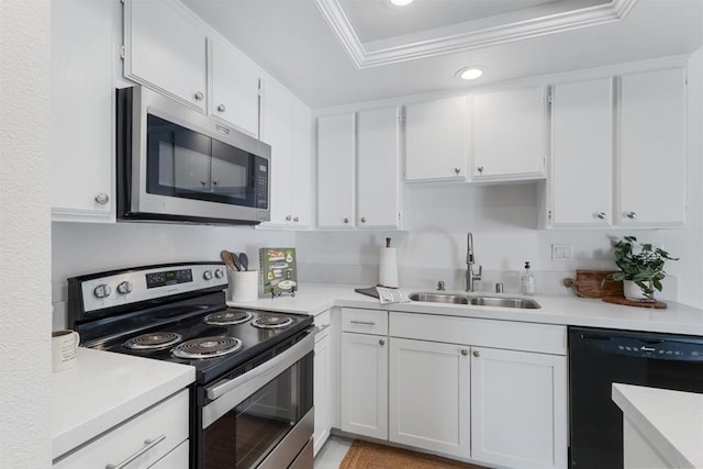 kitchen featuring stainless steel appliances, white cabinetry, sink, and crown molding