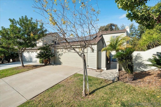 single story home featuring a garage and a front lawn