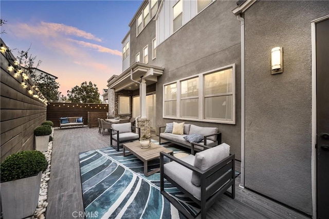 patio terrace at dusk with an outdoor living space