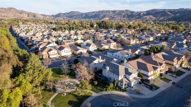 birds eye view of property featuring a mountain view