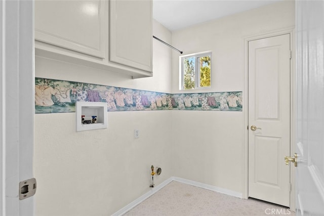 laundry area with washer hookup, cabinet space, gas dryer hookup, and light floors