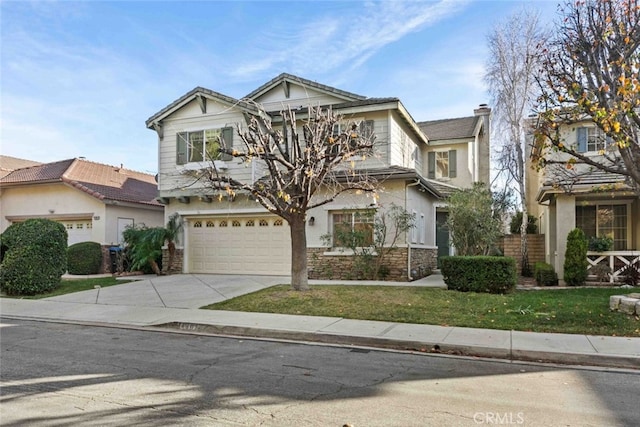 view of front facade featuring driveway, a garage, a front lawn, and stucco siding