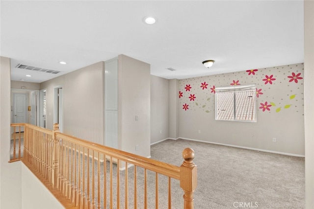 hallway with carpet floors