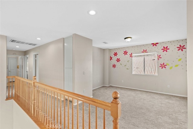 hallway featuring recessed lighting, baseboards, visible vents, and carpet flooring