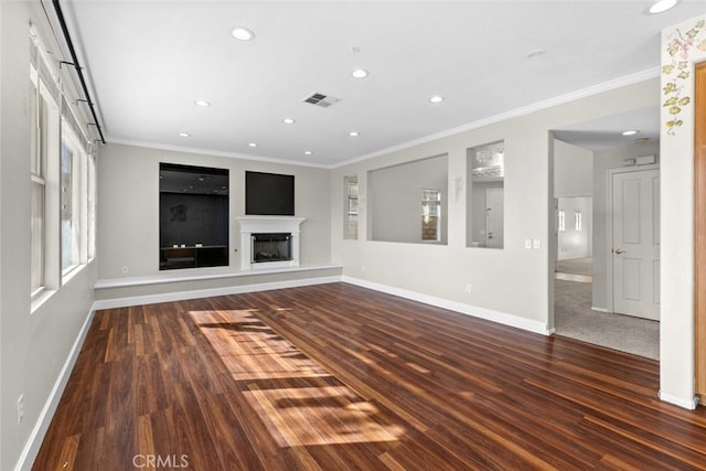 unfurnished living room featuring ornamental molding and dark hardwood / wood-style flooring