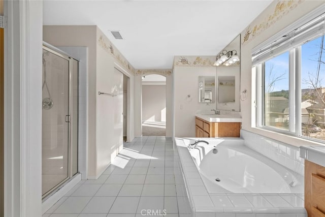 bathroom with a garden tub, visible vents, vanity, tile patterned floors, and a stall shower