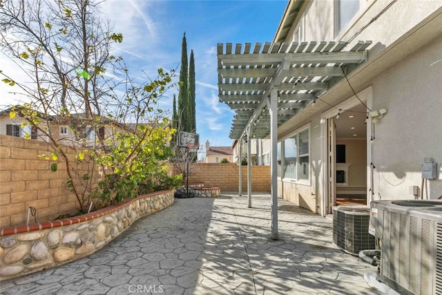 view of patio / terrace with a pergola and central AC unit