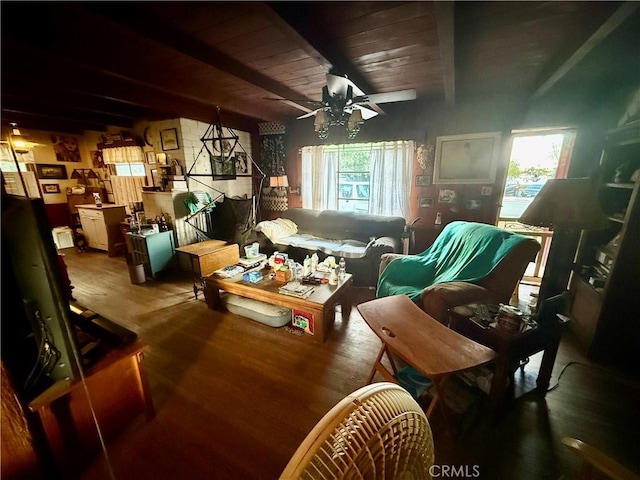 living room with ceiling fan, a wealth of natural light, wooden ceiling, and beam ceiling