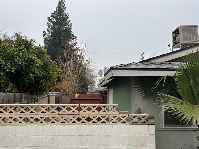 view of side of home featuring cooling unit