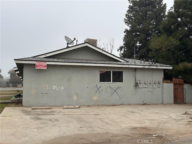 view of side of home featuring a patio area