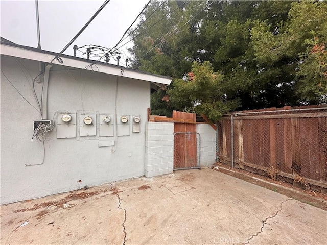 view of side of home with a patio area