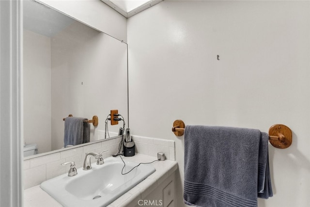 bathroom with sink and toilet