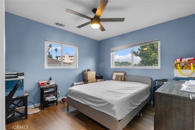 bedroom featuring dark wood-type flooring and ceiling fan