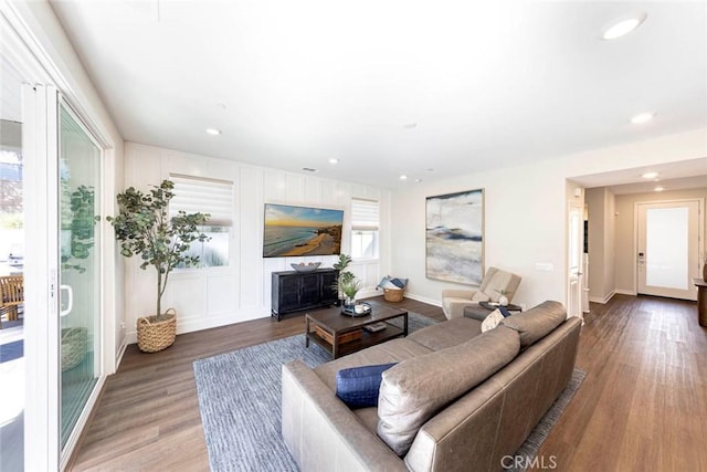 living room featuring hardwood / wood-style flooring and a healthy amount of sunlight