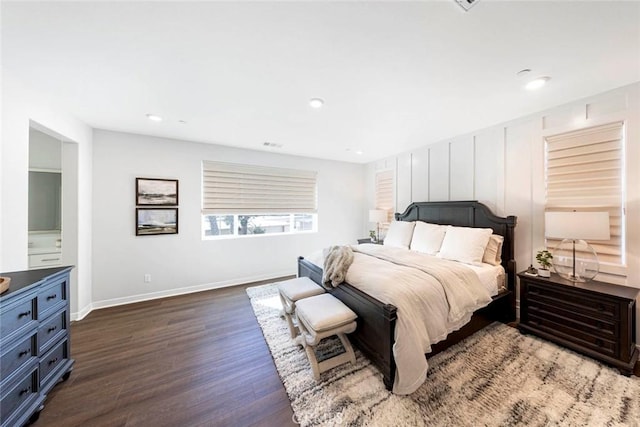 bedroom with dark hardwood / wood-style flooring