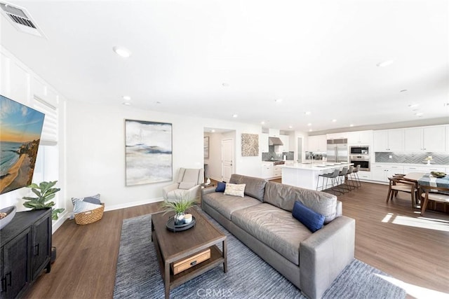 living room featuring dark hardwood / wood-style flooring