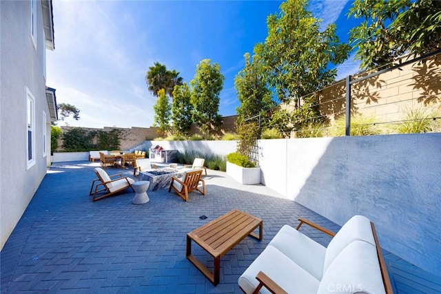 view of patio / terrace with an outdoor fire pit