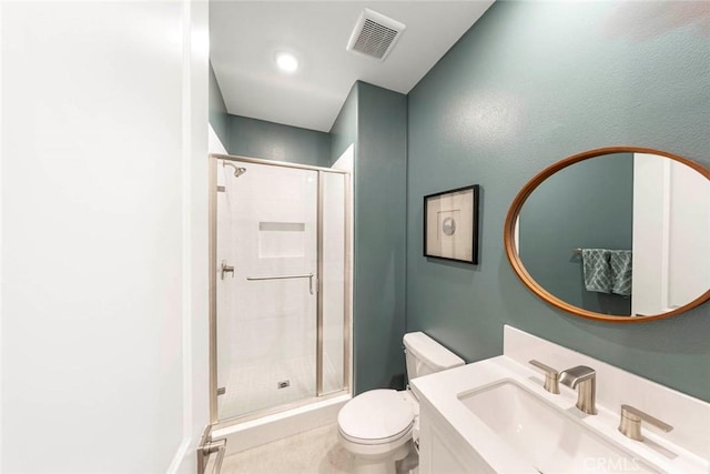 bathroom featuring walk in shower, vanity, and toilet