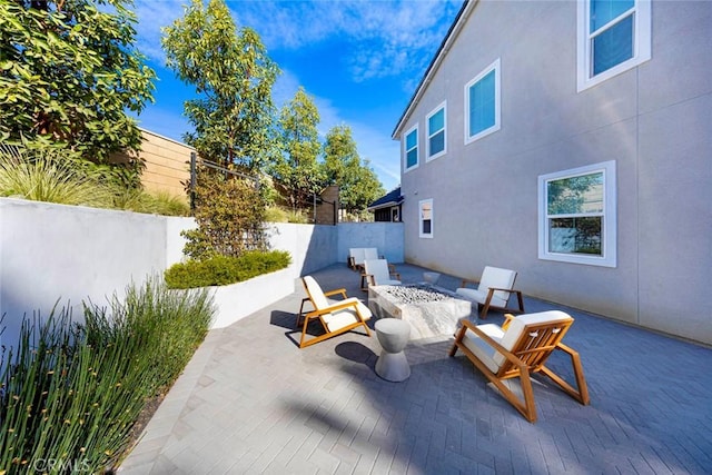 view of patio featuring a fire pit