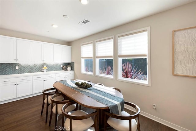 dining space featuring dark hardwood / wood-style flooring