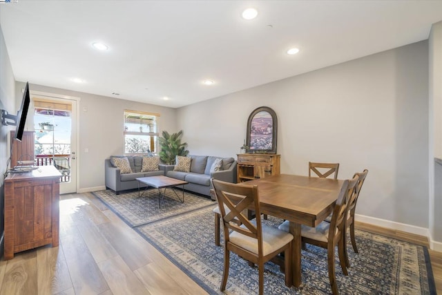 dining area with light hardwood / wood-style flooring