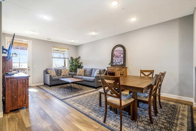 dining space featuring light wood-type flooring