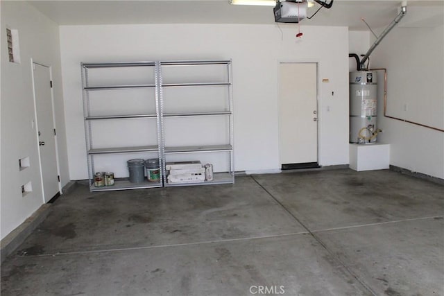 garage featuring a garage door opener and water heater