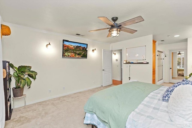 bedroom featuring ornamental molding, light colored carpet, visible vents, and baseboards