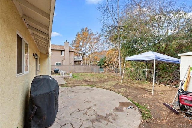 view of yard featuring a patio and a fenced backyard