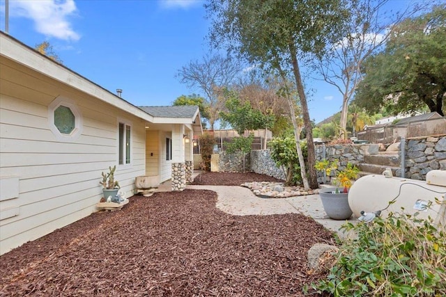 view of yard featuring fence