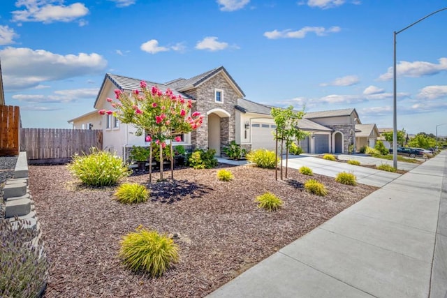 view of front of property with a garage