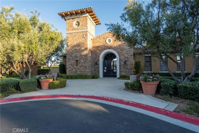 30272 Tattersail Way, Menifee, CA 92584 - view of front of property featuring stone siding and french doors