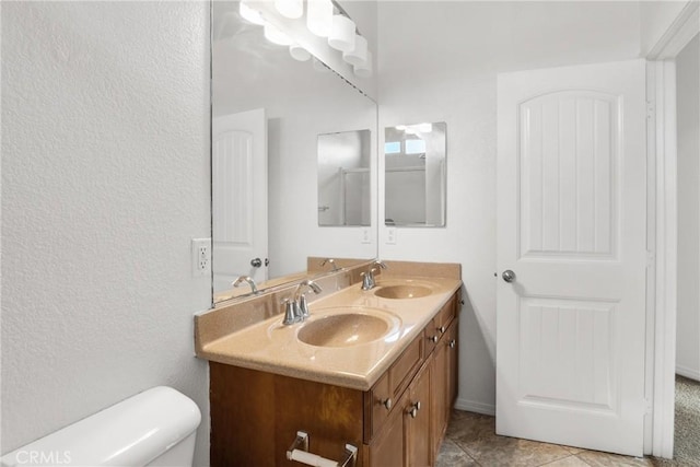 30272 Tattersail Way, Menifee, CA 92584 - full bathroom featuring toilet, double vanity, and a textured wall