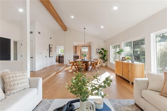 living room featuring light wood-style floors, recessed lighting, beamed ceiling, and high vaulted ceiling