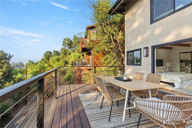 wooden deck with outdoor dining area